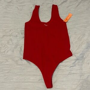 Red thong body suit